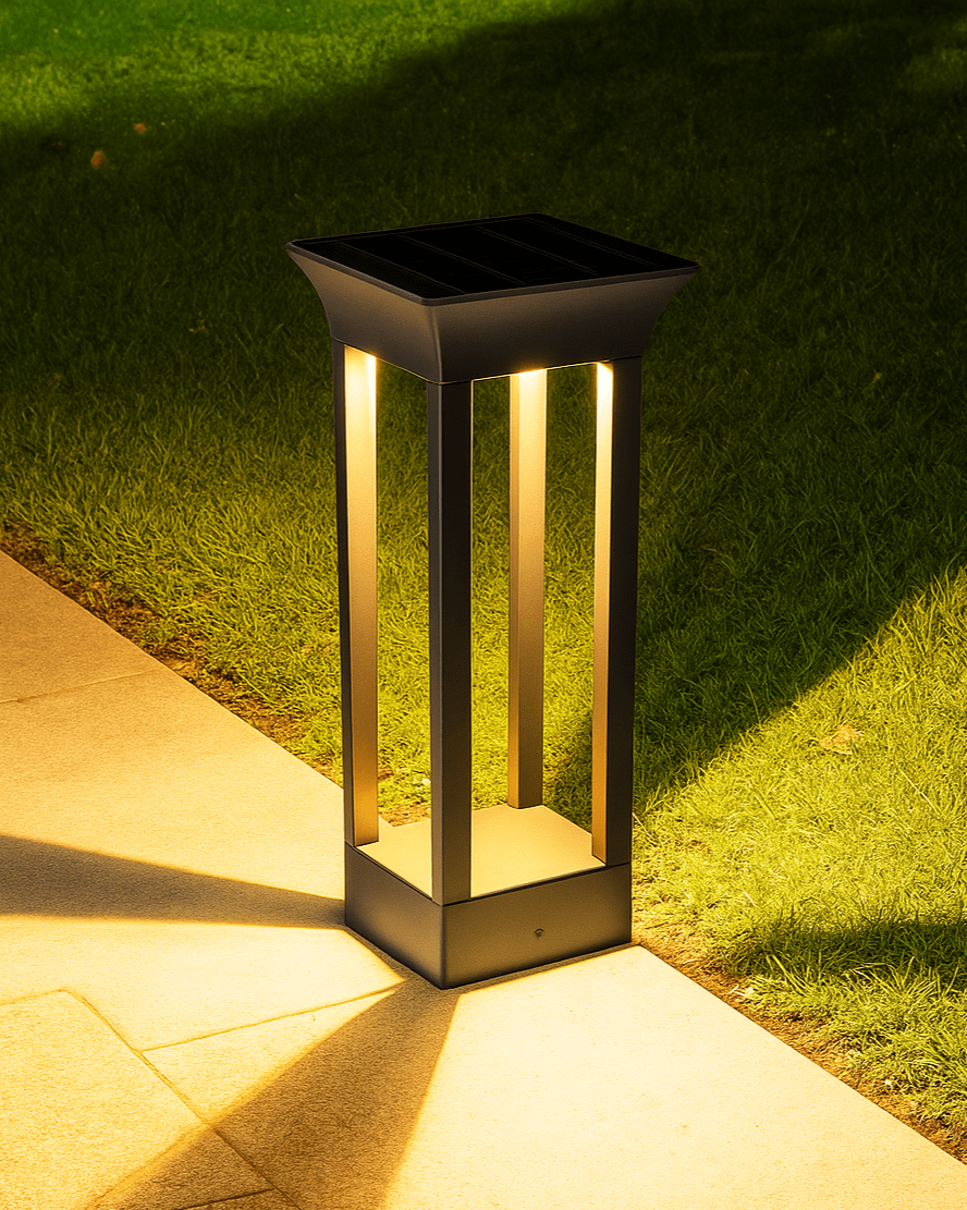 Hashira Column solar-powered outdoor light casting a soft glow in the garden at night.