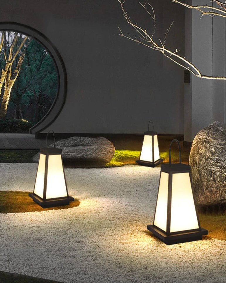 To Lantern casting warm ambient light in a serene garden setting