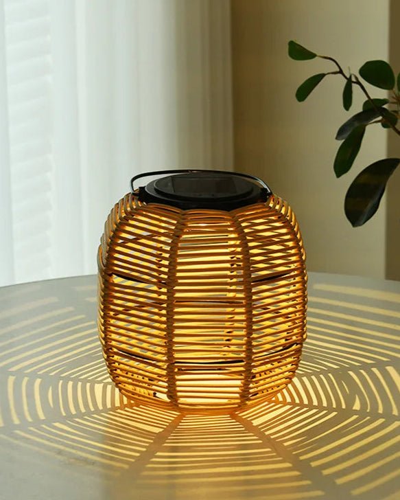 Kago Maru Lantern illuminating softly, showcasing its unique Japandi design and creating beautiful light patterns.
