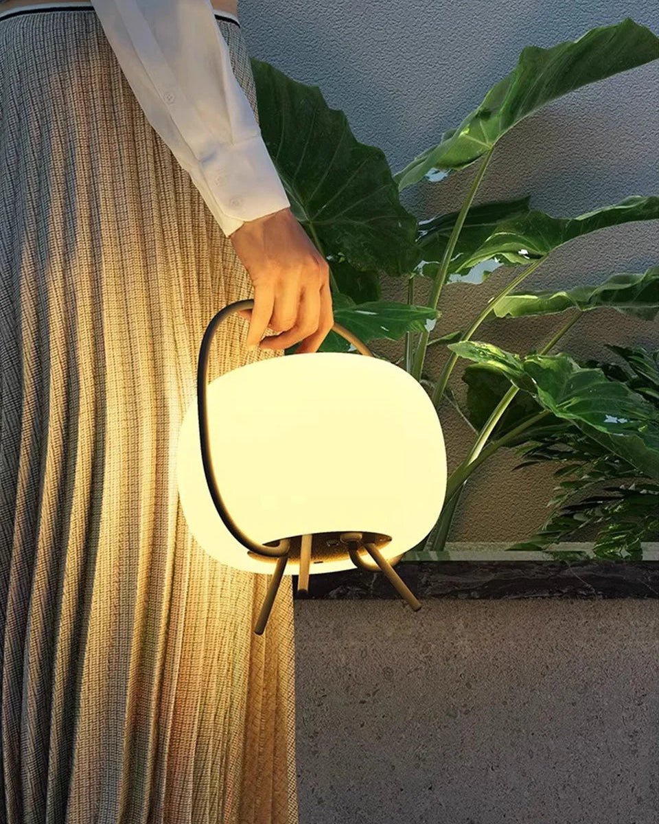 Tama Lantern held by hand showing portable Japandi solar design