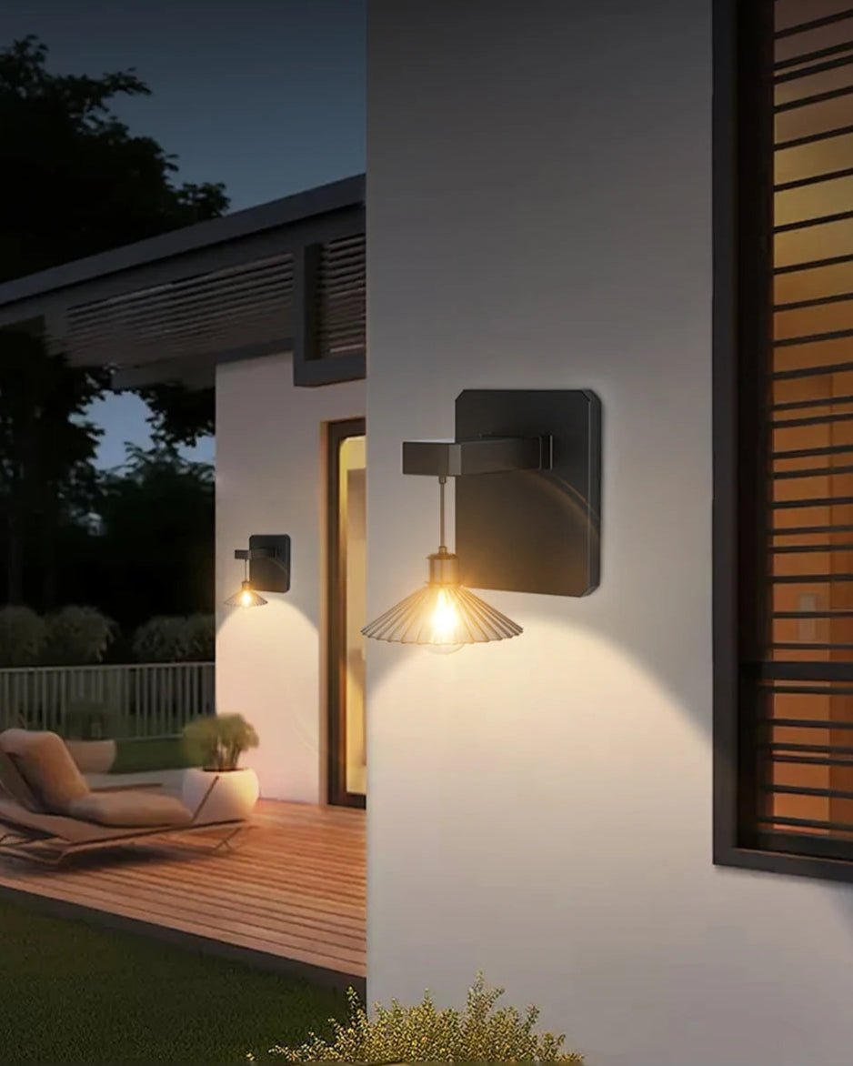 Kasa Wall Light softly illuminating an outdoor wall with serene ambiance