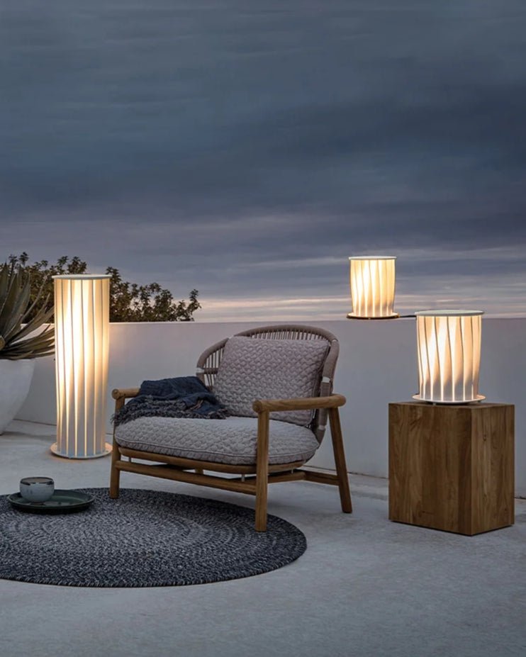 Nami Column Snow illuminating a pathway or garden with serene ambiance