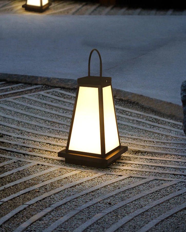 To Lantern casting warm ambient light in a serene garden setting