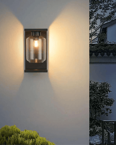 Yobi Wall Light softly illuminating an outdoor wall with serene ambiance
