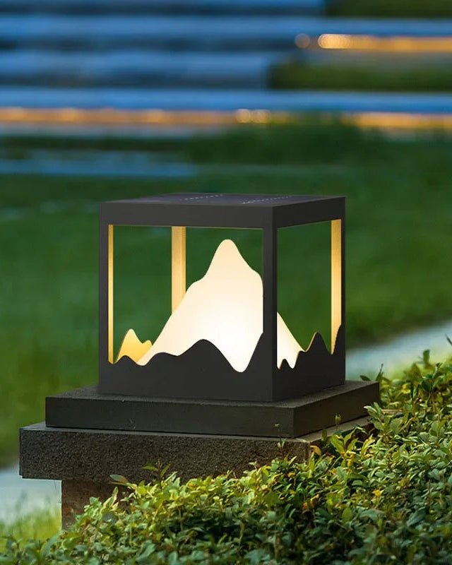 Yama Ground Light illuminating outdoor space with mountain-inspired design and warm glow.