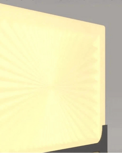 Kado Ground Light displayed with soft illumination on a square base, perfect for pathways and gardens.